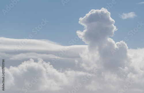 White cumulus cloud formation against blue sky with copy space