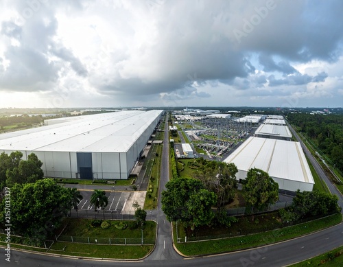 Massive hyperscale data center campus stretching across a vast site, showcasing modern infrastructure, secure facilities and high-tech architecture.