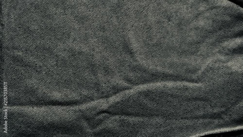 charcoal knit fabric texture macro draped in soft folds as moody minimal backdrop for web banner and textile branding