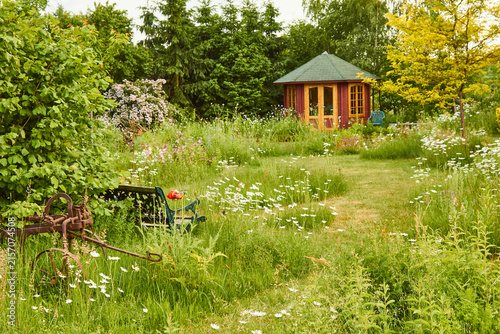 Фотография garden with red garden house in an ecologically desirable way 744