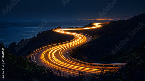 Curving highway at night showcasing captivating light trails from vehicles.