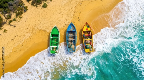 Colorful fishing boats rest on a sandy beach alongside turquoise ocean waves in a scenic aerial view vessels watercraft