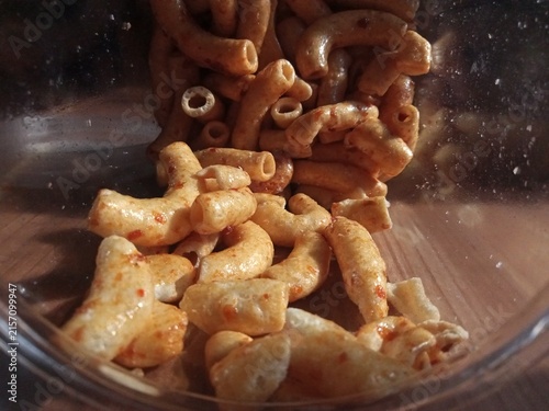 Canvas Print Macaroni chips in a clear jar on a table—perfect for product photos