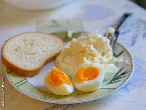Healthy Rustic Breakfast Plate with Soft Boiled Eggs, Cottage Cheese, and Bread