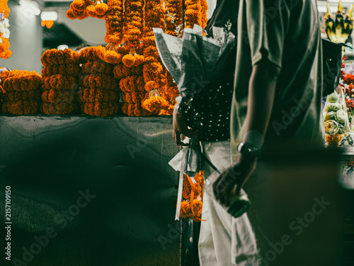 Photography Marigold flower garlands displayed at night market flower stall