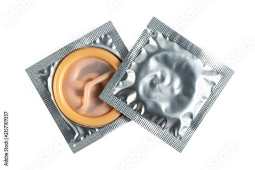 Naklejka Two opened condom packs showcasing individually wrapped condoms ready for use
