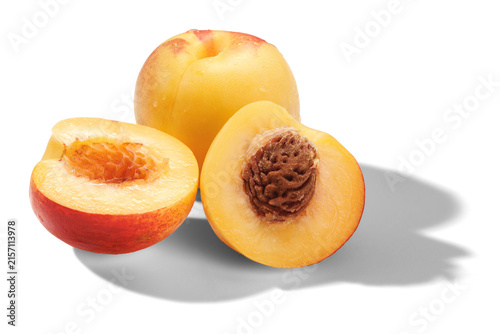 Ripe whole and halved nectarines, transparent background, shadow