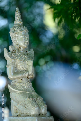 Traditional Thai Angel Statue Praying with Hands Together and Copy Space