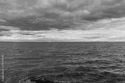 Photography Stormy sky looms over churning sea
