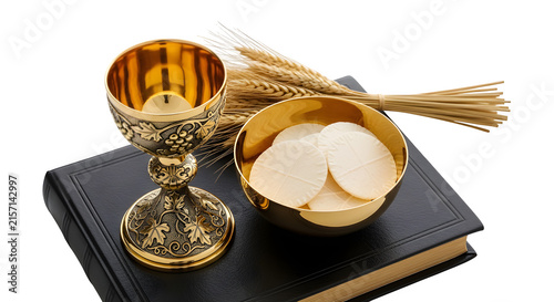 Catholic eucharist chalice and paten with communion wafers on a bible isolated on transparent background