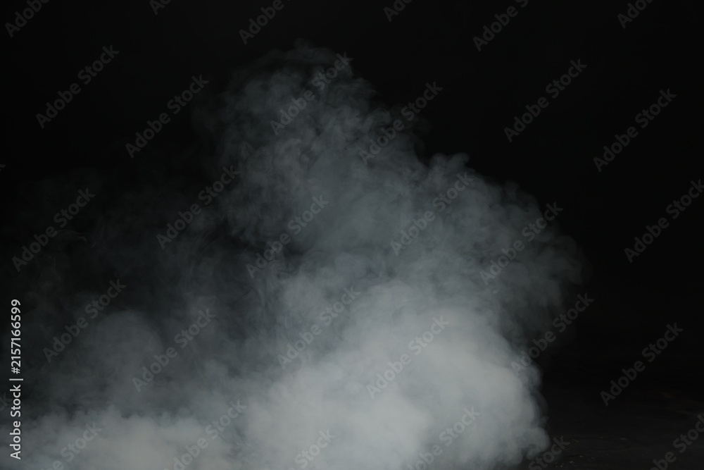 Fototapeta premium Beautiful smoke in light on dark background