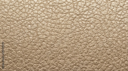 Gold metallic leather texture background macro photograph