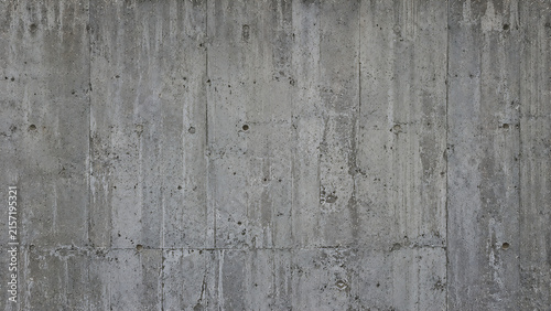 Industrial concrete wall texture, weathered gray cement surface, brutalist architectural background for design projects