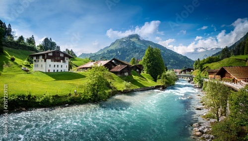 swiss landscape with river stream and houses