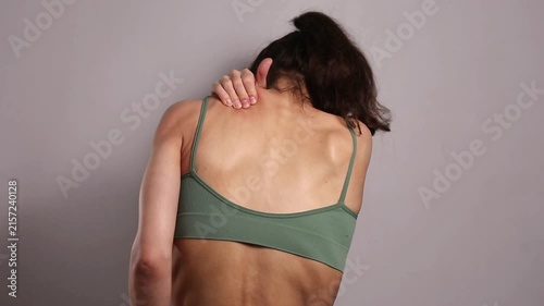 Wellness video of woman performing self massage for neck, shoulders muscles relaxation and recovery, wellness self care routine, body care and healthy lifestyle concept with copy space background