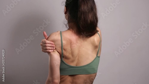 Wellness video of woman performing self massage for shoulder, arm muscles relaxation and recovery, wellness self care routine, body care and healthy lifestyle concept with copy space background