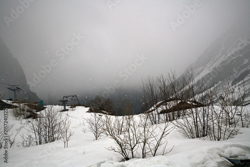 Russia. North Ossetia. Tsei Ski Complex. Upper Station 2870. View towards the bottom station. Snow fog