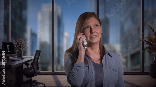 Woman talking on phone in office setting