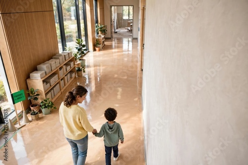 Happy Family Strolling Through a Modern Indoor Lobby