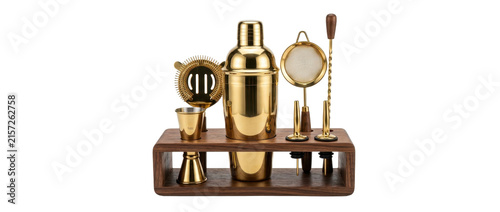 Polished gold cocktail shaker set displayed on dark wooden stand against isolated white studio background for bar supply inventory