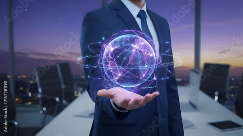 Businessman holding glowing digital globe for global connectivity and innovation solutions