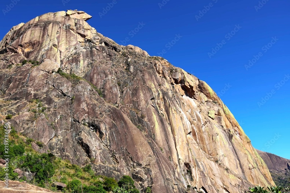 Fototapeta premium Sheer Granite Rock Face Rising Against Clear Blue Sky in Madagascar