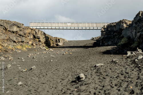 The Bridge between Continents is a 15 meter (50 ft) footbridge spanning a rift between the Eurasian and North American tectonic plates.