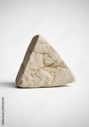 Obraz w ramie High resolution photograph of a single triangular beige rock with sharp edges and a textured surface, isolated on a neutral white backdrop, surface, rugged, simple