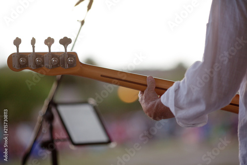 Konstfotografi Bass guitarist performing outdoors at live music event
