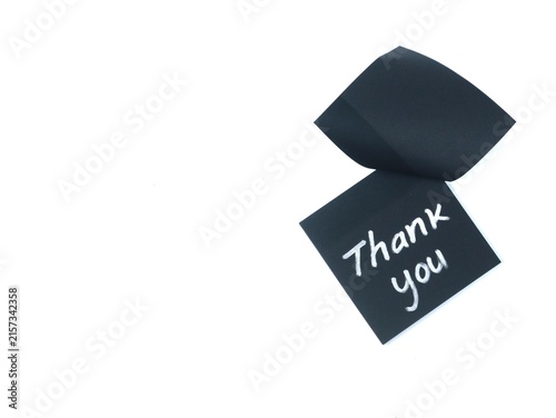 Quadro su tela Thank you handwritten phrase on a black adhesive note isolated on white background with copy space