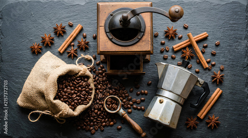 Coffee preparation still life with grinder and moka pot.