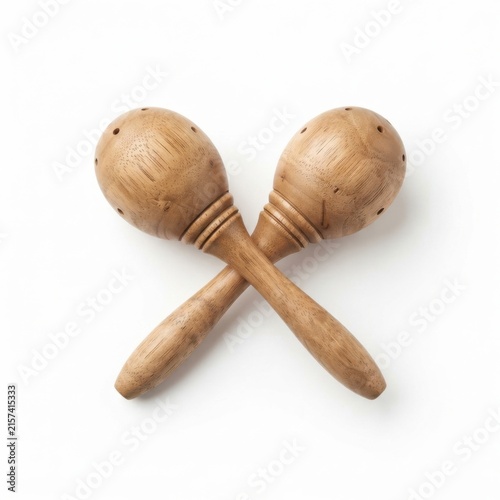 Crossed wooden maracas on neutral background