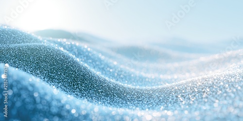 Shimmering blue waves of tiny, sparkling particles under a soft sky