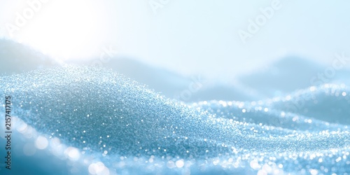 Soft, sparkling light reflects on undulating, icy blue crystalline dunes