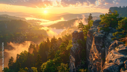 Breathtaking Aerial View of Golden Sunrise Over Misty Valley and Forest Mountains with Rocky Cliffs