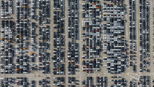 Aerial view new car lined up, Automobile automotive car parking lot commercial business industry,  Port of import export business logistic dealership, New cars global business logistic import export.