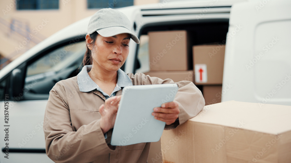 © peopleimages.com - Tablet, woman and delivery service by van for courier transport, shipping and distribution. Check, technology and cargo boxes by vehicle with online schedule, address app or checklist for package © peopleimages.com - Tablet, woman and delivery service by van for courier transport, shipping and distribution. Check, technology and cargo boxes by vehicle with online schedule, address app or checklist for package