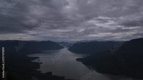 An aerial video showing the forest, mountains, and river in the morning.