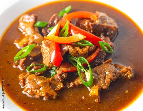 Hearty beef stir fry with peppers and onions.