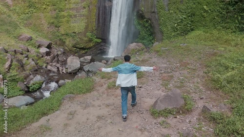 A Serene Journey to the Majestic Waterfall: Embracing Nature's Beauty and Tranquility
