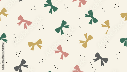Seamless repeating pattern of colorful hair bows and ribbons with small decorative dots on a light cream background.