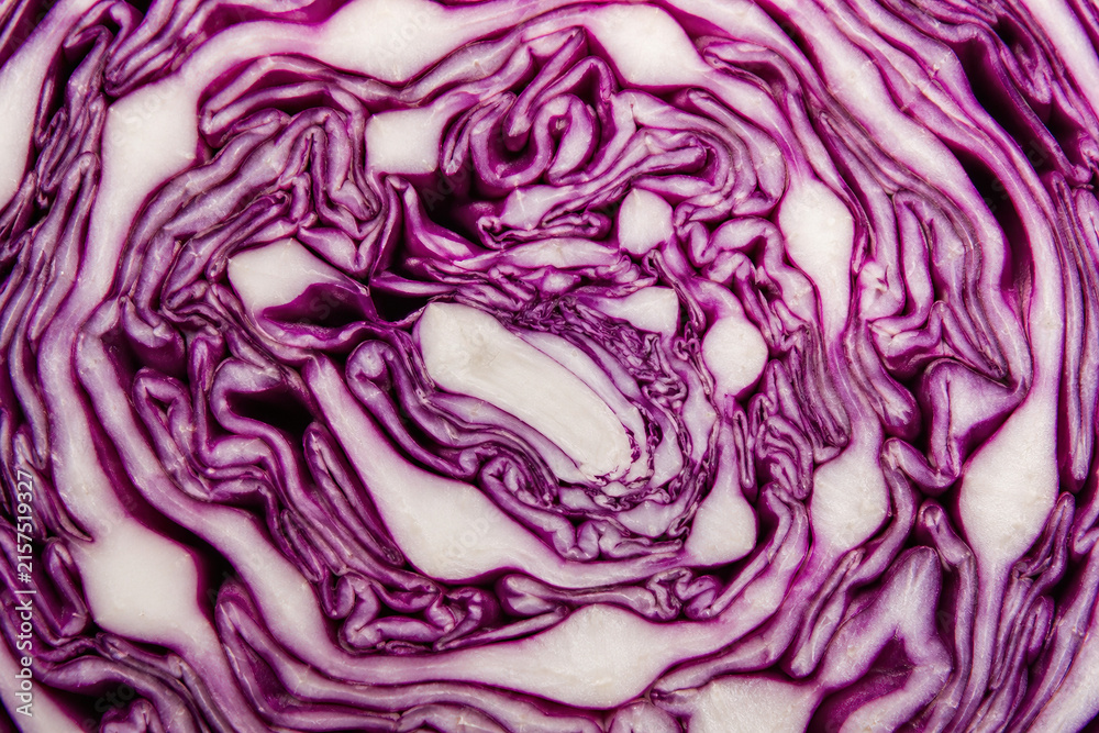 Obraz premium Cross Section of Fresh Red Cabbage With Wavy Leaves
