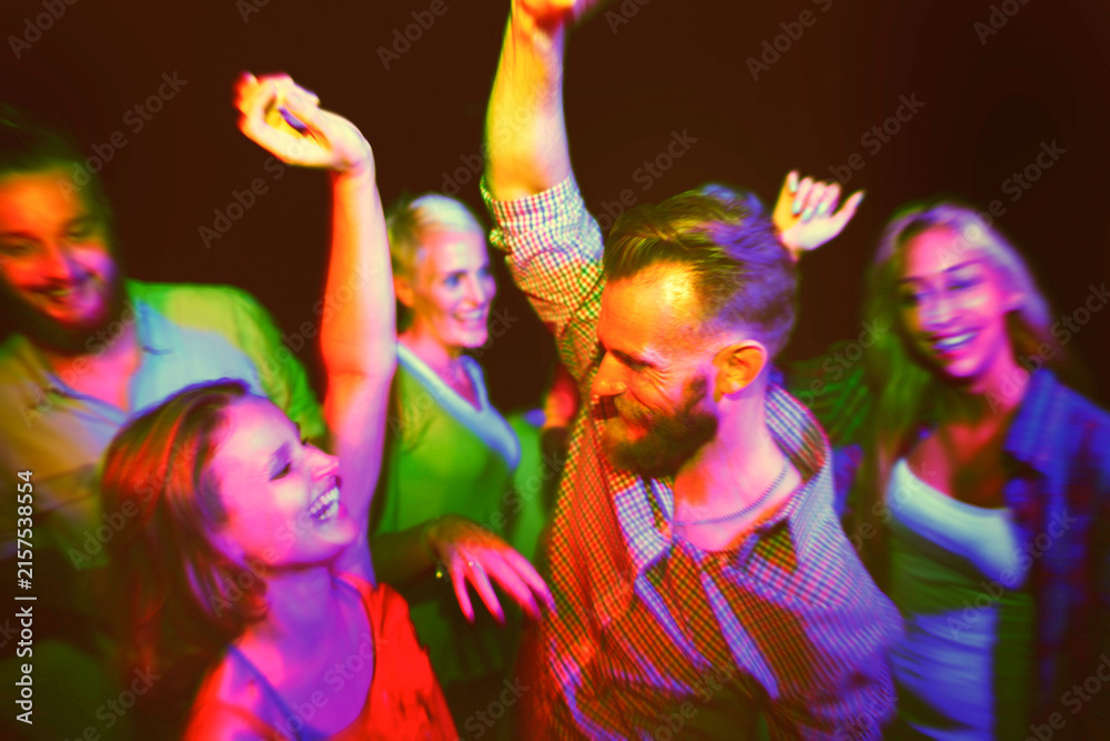 Obraz premium Vibrant group dancing joyfully at a lively party