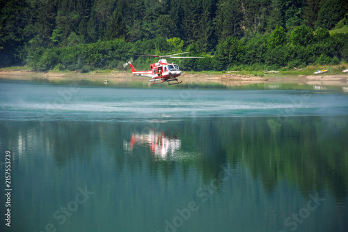 Firefighting aircraft filling large water tanks to put out forest fires