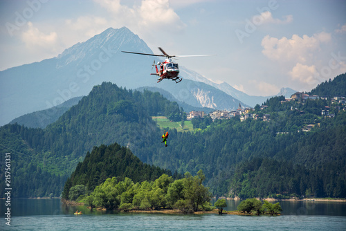 Emergency operations on the lake with helicopters dropping rescuers for the shipwrecked