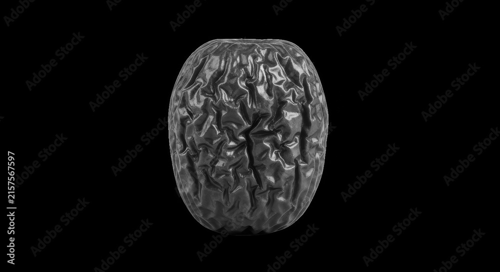 Naklejka premium Wrinkled dark passion fruit isolated on black background object.
