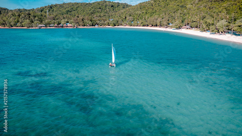 Canvastavla Group of sailer are enjoy sailing the dinghy boat at the corner of the tropical