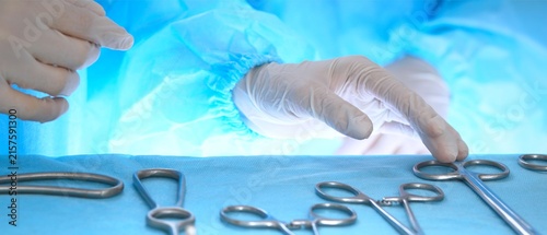 Surgeon Selecting Surgical Instruments in Operating Room