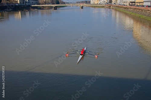 Shell boat on the river in Florence Italy