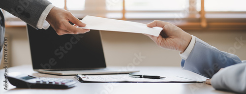 Obraz na plátně Close up of employee handing resignation letter or application to manager